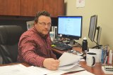 Lemoore 'Interim" City Manager Nathan Olson in his Cinnamon Complex office recently preparing for another meeting.